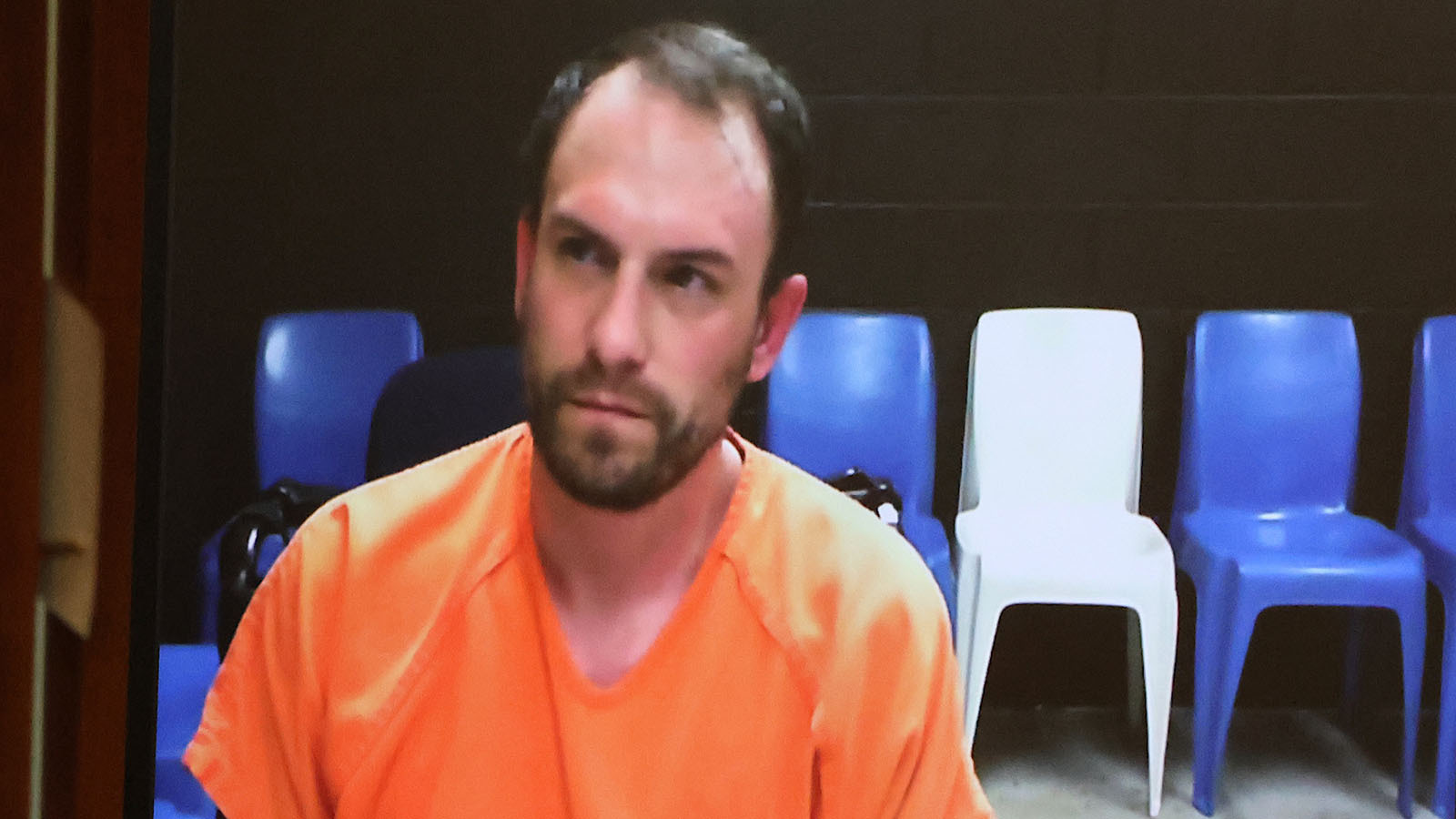Andrew Barrett appeared via video screen in Casper Circuit Court from the Natrona County Jail. During his appearance he barked, made animal noises, put his fingers into a pistol-like gesture and calmly answered the judge.
