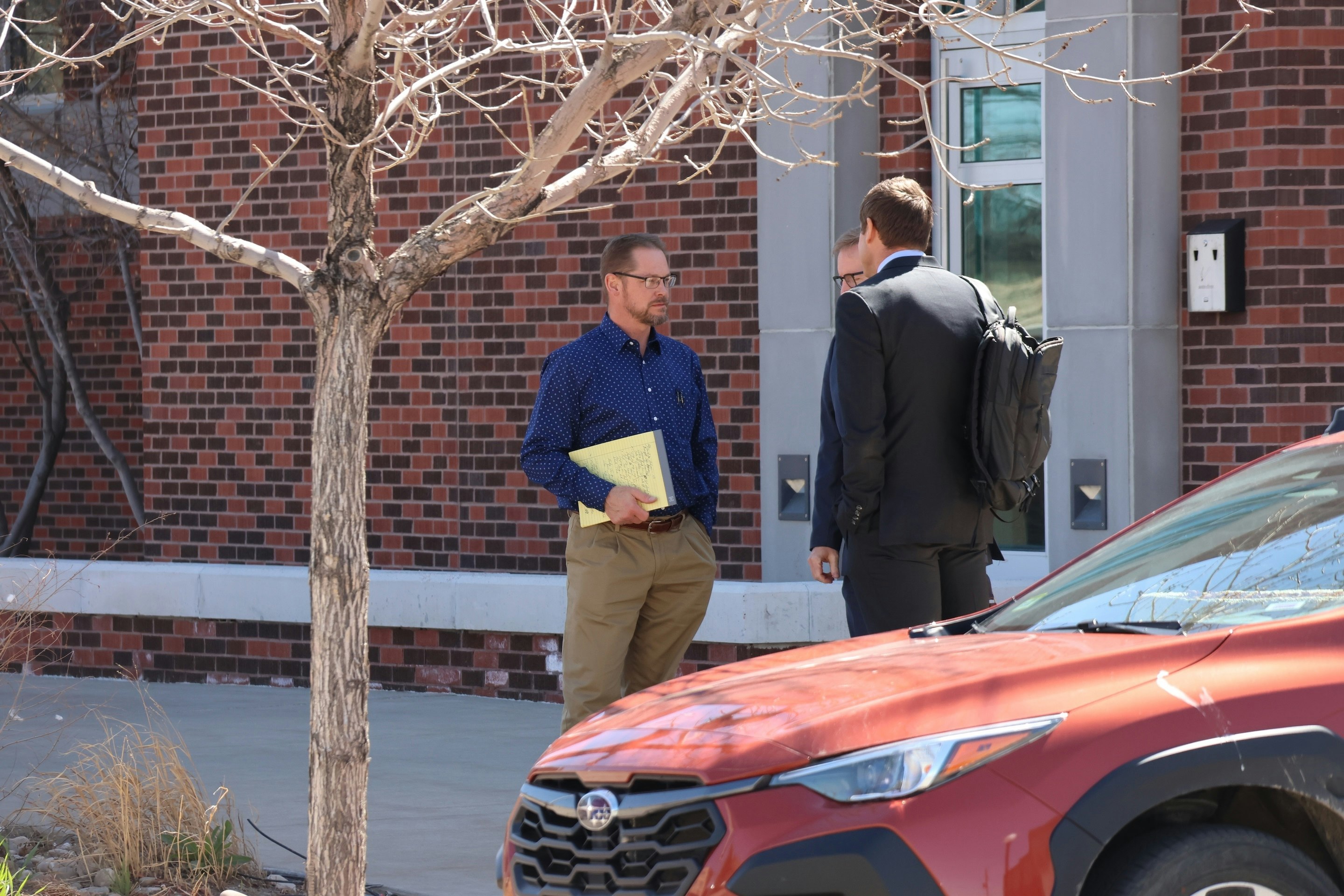 Marler listens to his attorneys after a break in his trial in April.
