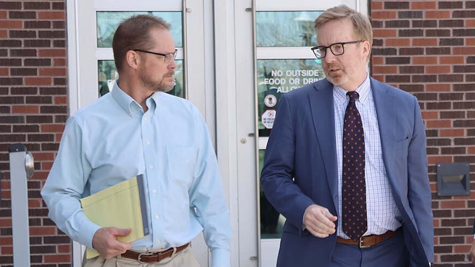 Steven Marler, left, and attorney John Hummel leave the Natrona County District Court during Marler’s April trial.