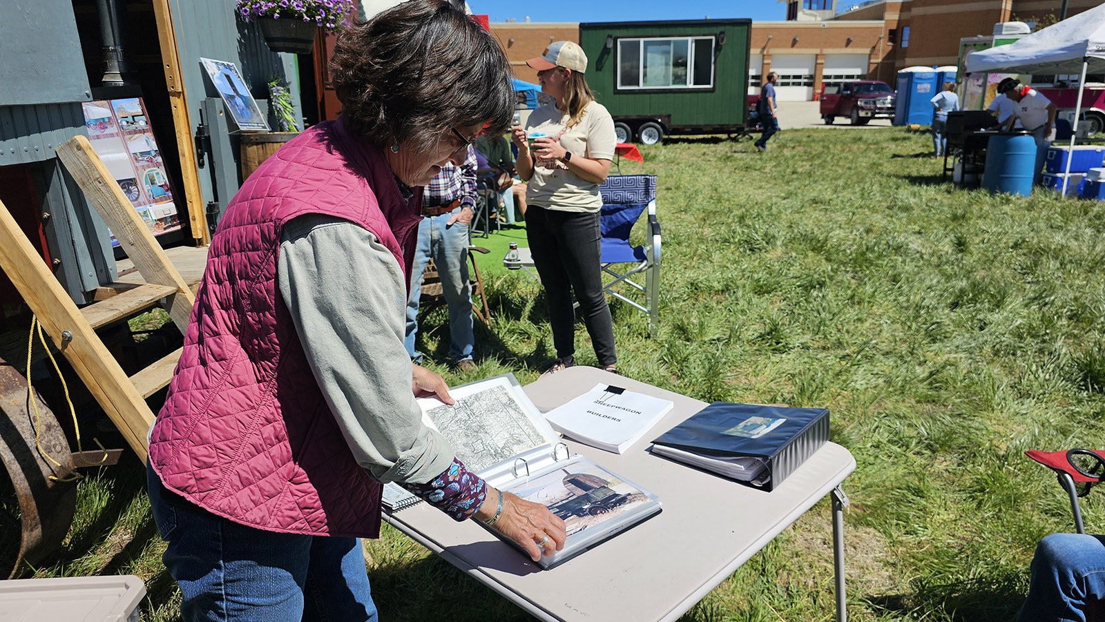 Lora O'Rourke looks through a scrapbook of sheep wagons she and her husband, the late Jim O'Rourke, have restored. Many of the wagons came from Wyoming. The wagons are going to become part of a museum on the O'Rourke's RUJODEN Ranch in Nebraska, two hours from Lusk, Wyoming.