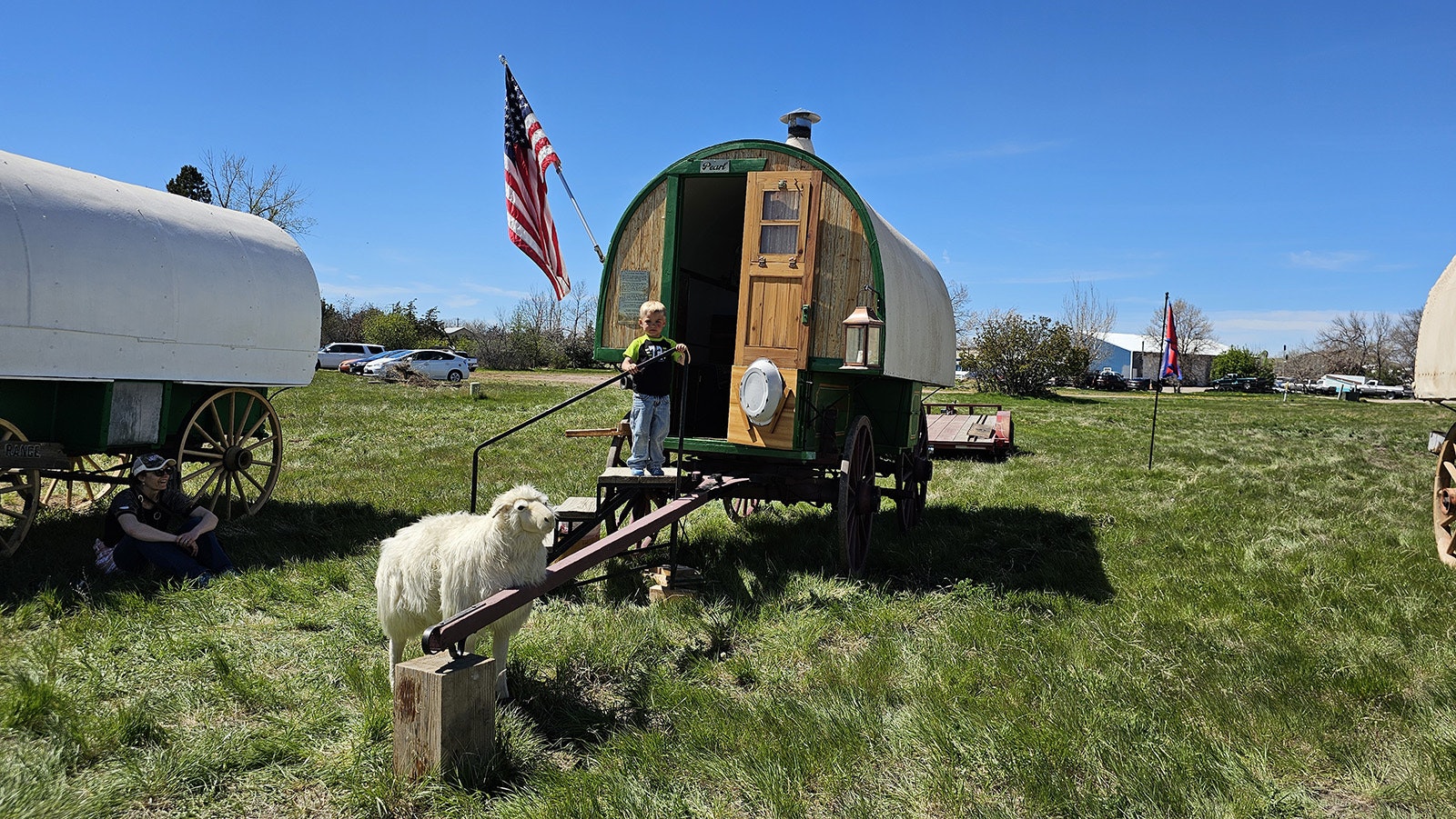Sage Walker checks out The Pearl, a sheep wagon owned and restored by Doug Mikkelsen, while mom Jenna Walker looks on. The wagon was one of nine on display at Gillette's third annual Sheepwagon festival.