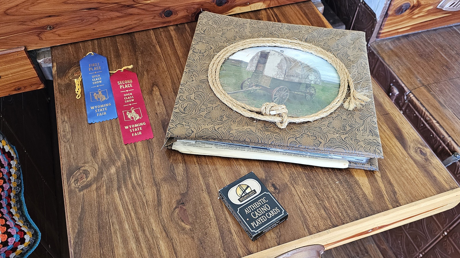 A scrapbook about The Pearl, along with two of its Wyoming State Fair ribbons.