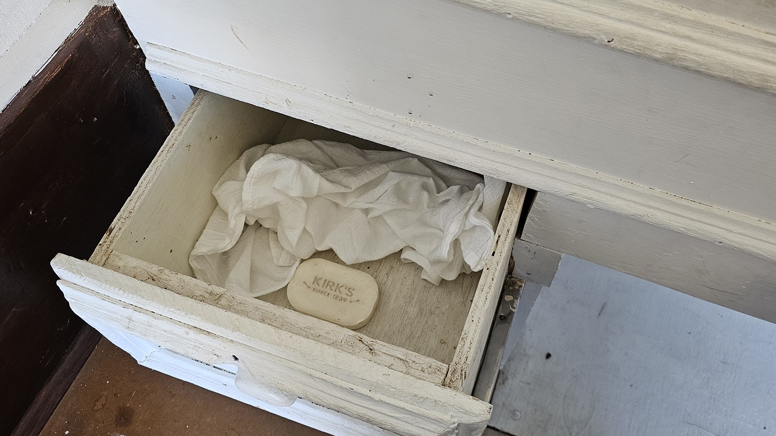 A drawer at the righthand side of the bed in a sheep wagon displayed at Gillette's third annual Sheepherding Festival. It holds soap and a towel.