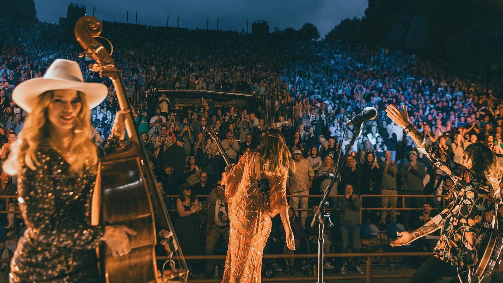 Shelby Means, left, performs at the legendary Red Rocks Amphitheater in Colorado.