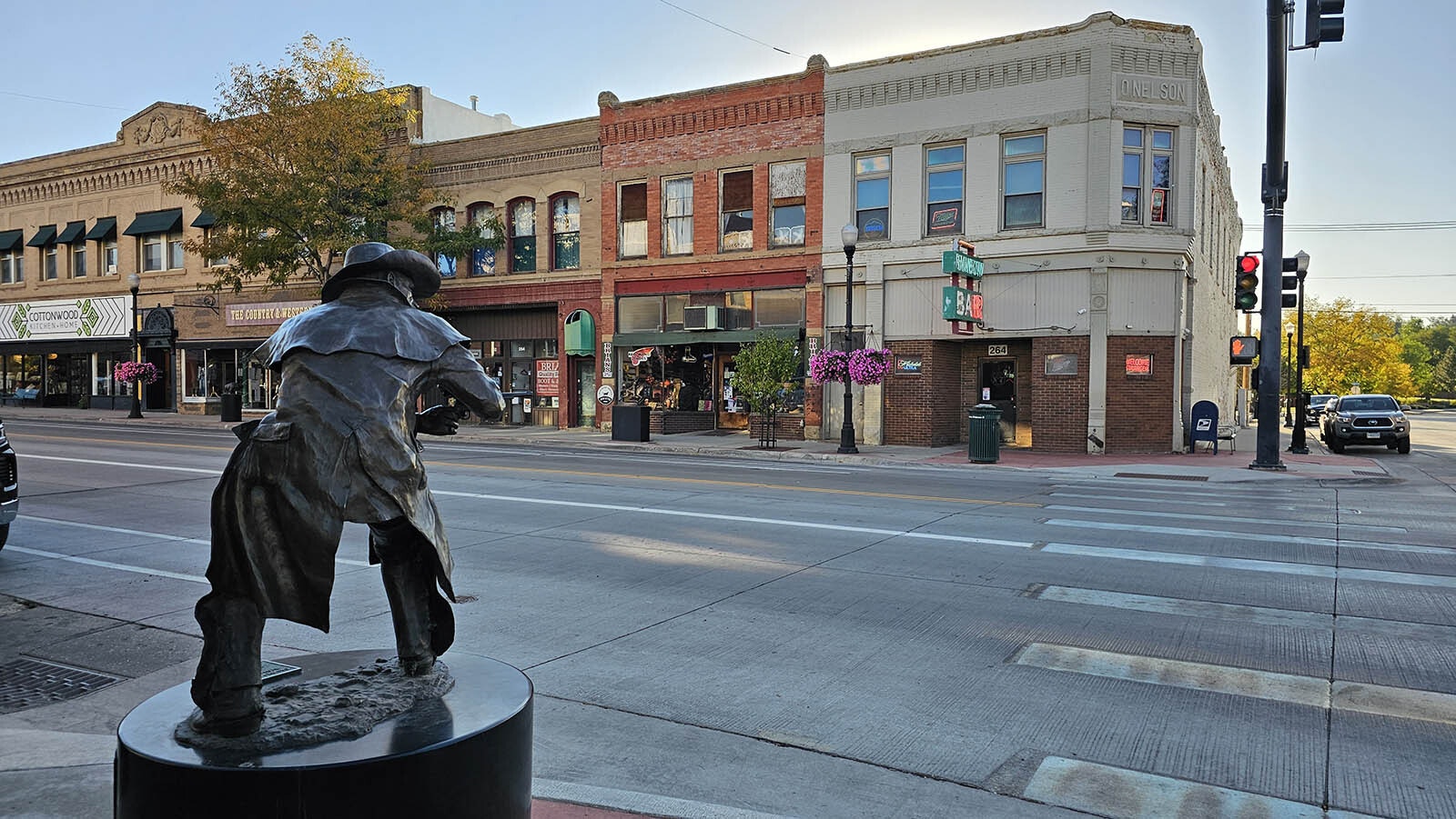 Perpetually shooting at invisible gunmen on Main Street in Sheridan, this statue is a popular one for tourist selfies, right across from the Rainbow Bar and Le Reve (not pictured).