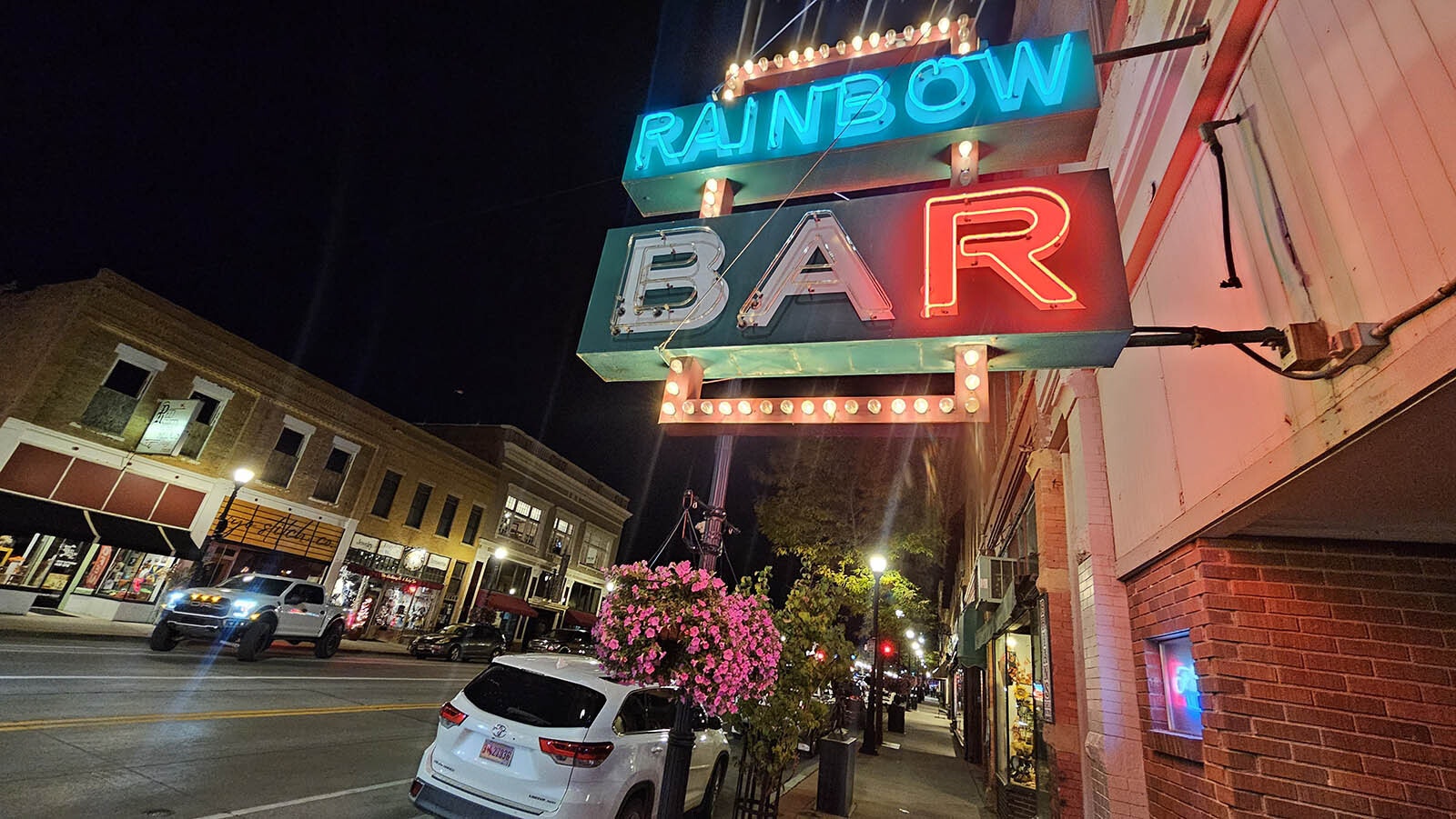 The Rainbow Bar also features a neon sign and gets a lot of patrons at night.