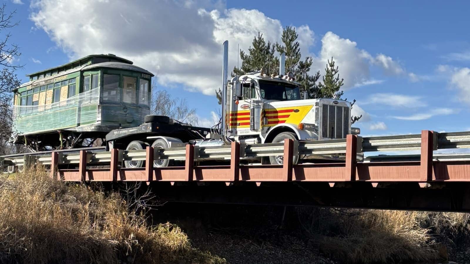 "Ol' 115," a streetcar that ran through Sheridan in the 1920s, made its final trip through town to the Sheridan Community Land Trust's headquarters. The historic streetcar will be restored and used an outdoor educational display.