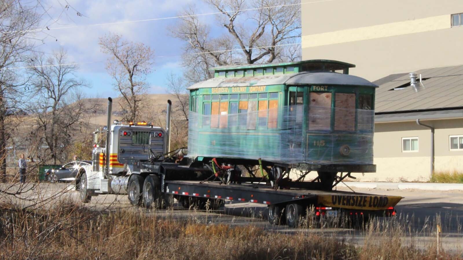 "Ol' 115," a streetcar that ran through Sheridan in the 1920s, made its final trip through town to the Sheridan Community Land Trust's headquarters. The historic streetcar will be restored and used an outdoor educational display.