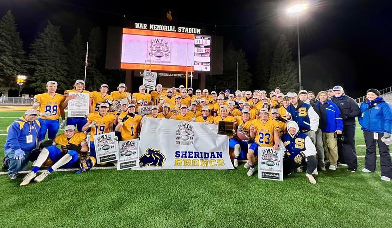 The Sheridan High School football team celebrates its fourth straight state championship on Saturday.