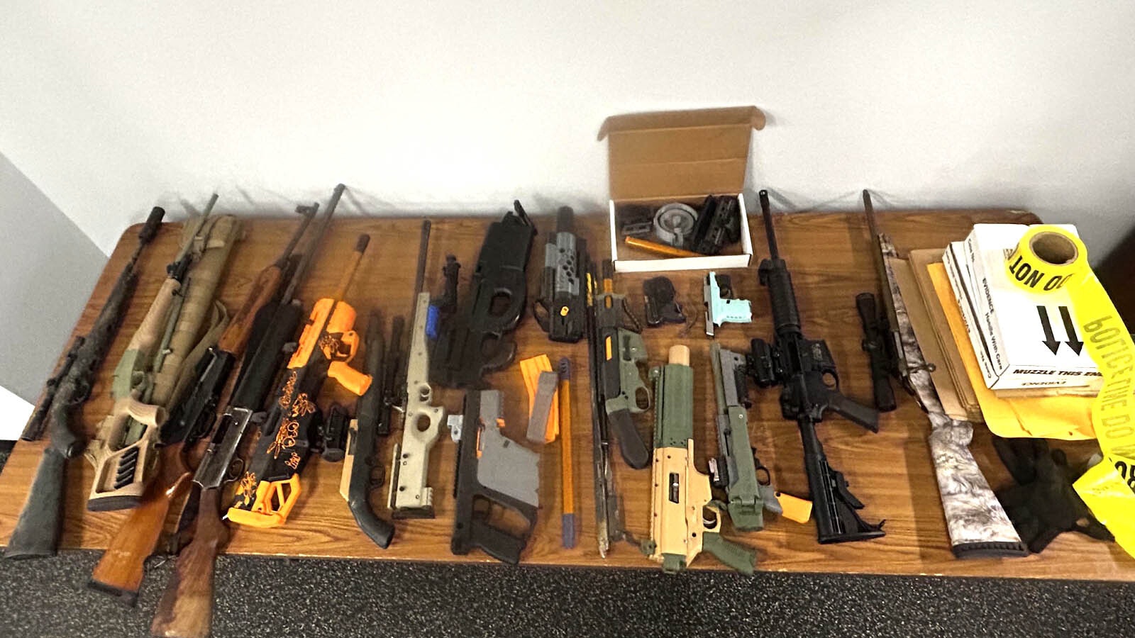 An array of store-bought and 3D-printed firearms and parts seized by the Sheridan Police Department.