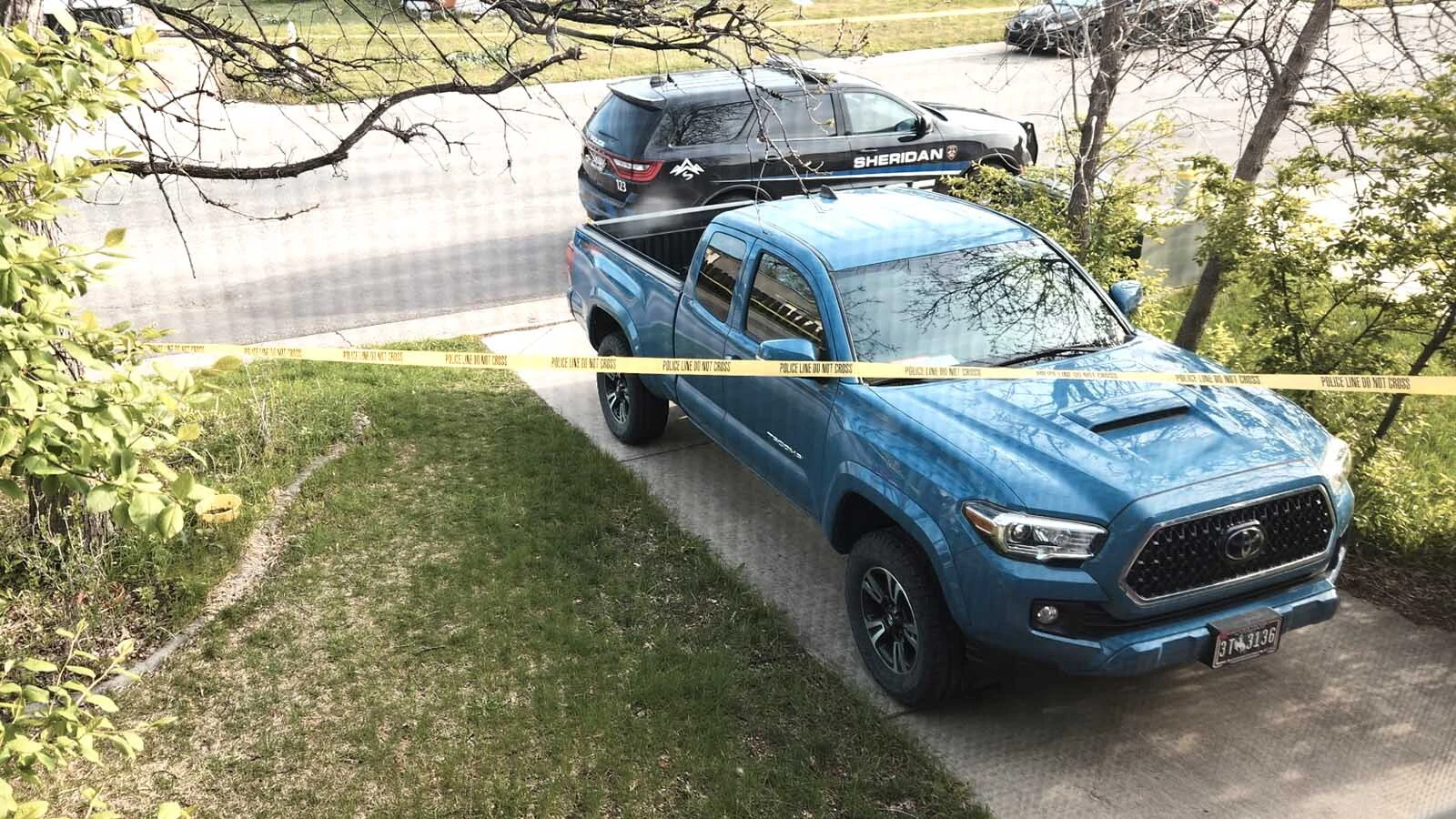 A frantic woman went from house to house pleading for help early Sunday morning, telling them her husband “has a gun." A neighbor said Monday that the man "sprayed" police cars with gunshots for around 20 minutes before being shot and hospitalized.