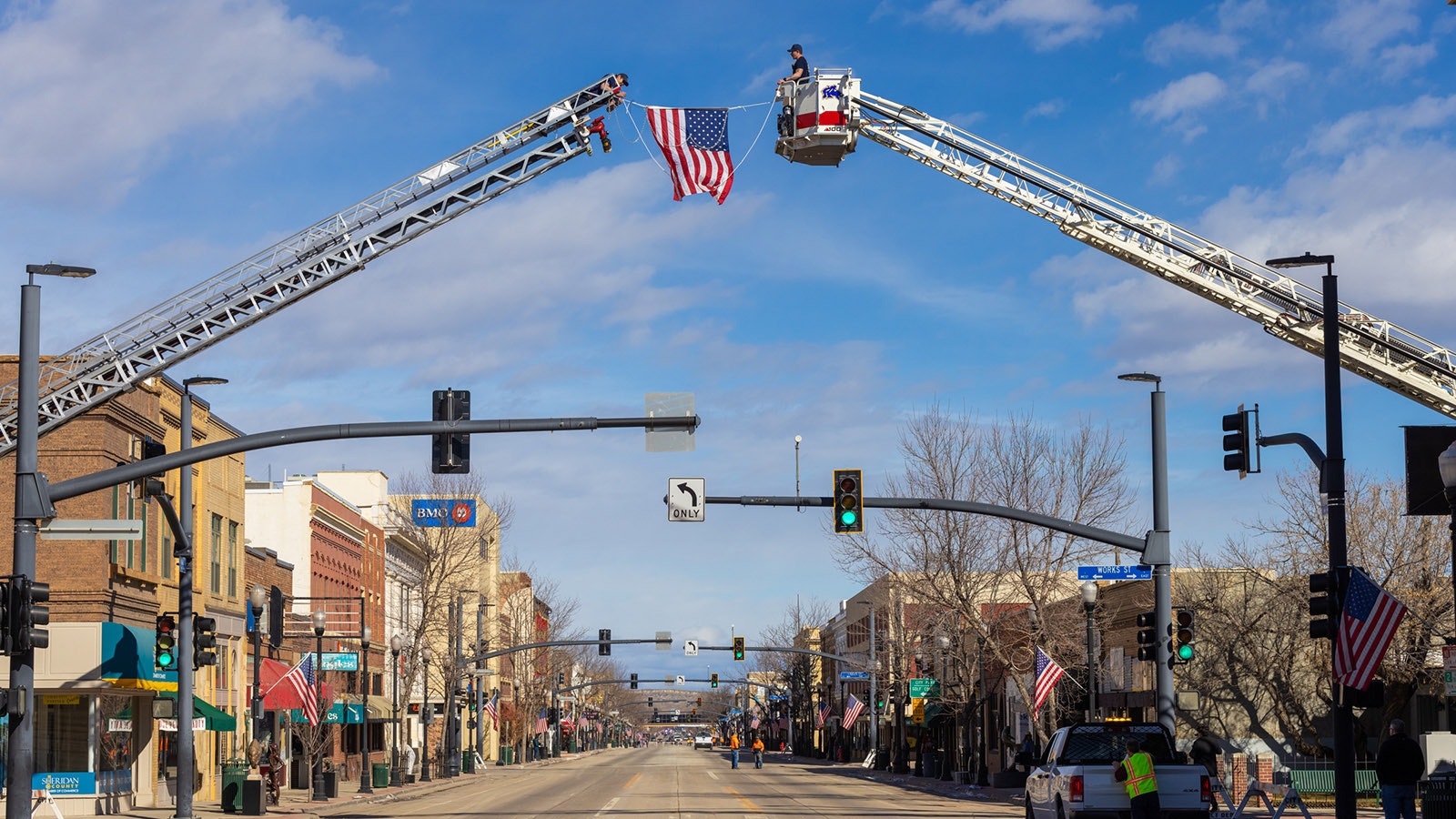 Flags are hung along the procession route ahead of Friday's memorial in Sheridan for police Sgt. Nevada Krinkee, who was shot and killed in the line of duty on Feb. 13.