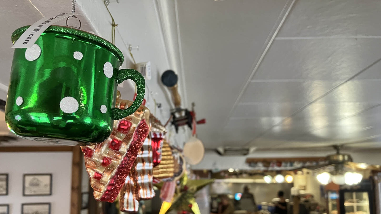 Holiday ornaments with food themes decorate the ceiling of Sherrie’s Place as a testament to her customer’s loyalty. She offered them free dessert for an ornament. She now has more than 100.