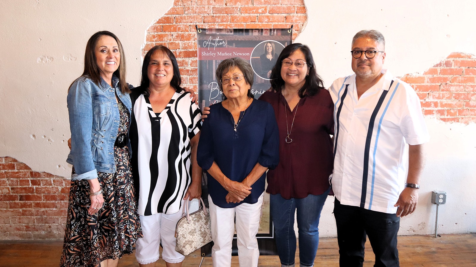 Shirely Munoz Newson, far left, with some members of her biological family, whom she didn't meet until after she learned before her 43rd birthday that she was switched at birth. They are, from left, cousin Brenda Munoz, aunt Mary Mercado, cousin Kim Accurso and cousin Nick Munoz.