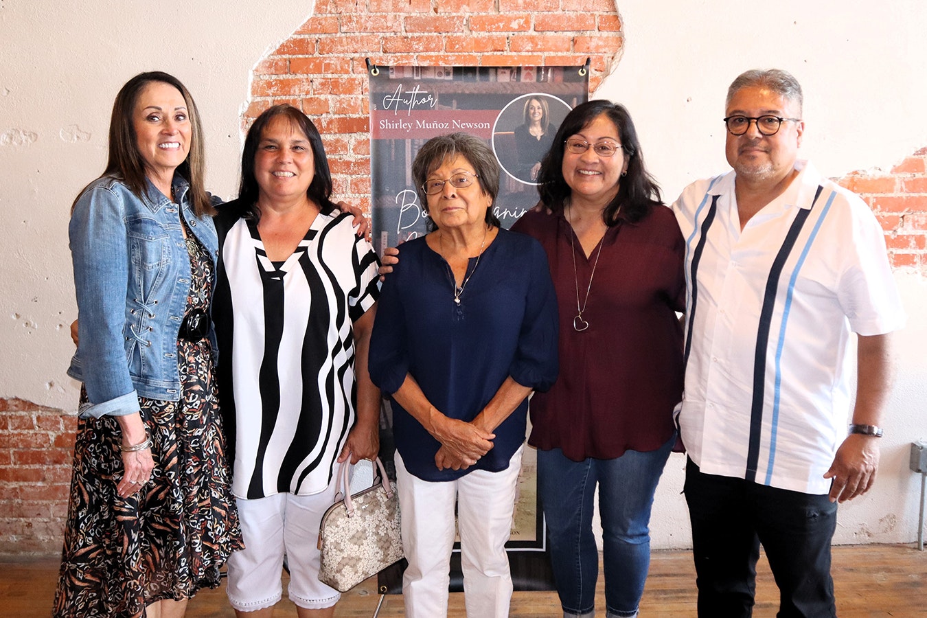 Shirely Munoz Newson, far left, with some members of her biological family, whom she didn't meet until after she learned before her 43rd birthday that she was switched at birth. They are, from left, cousin Brenda Munoz, aunt Mary Mercado, cousin Kim Accurso and cousin Nick Munoz.