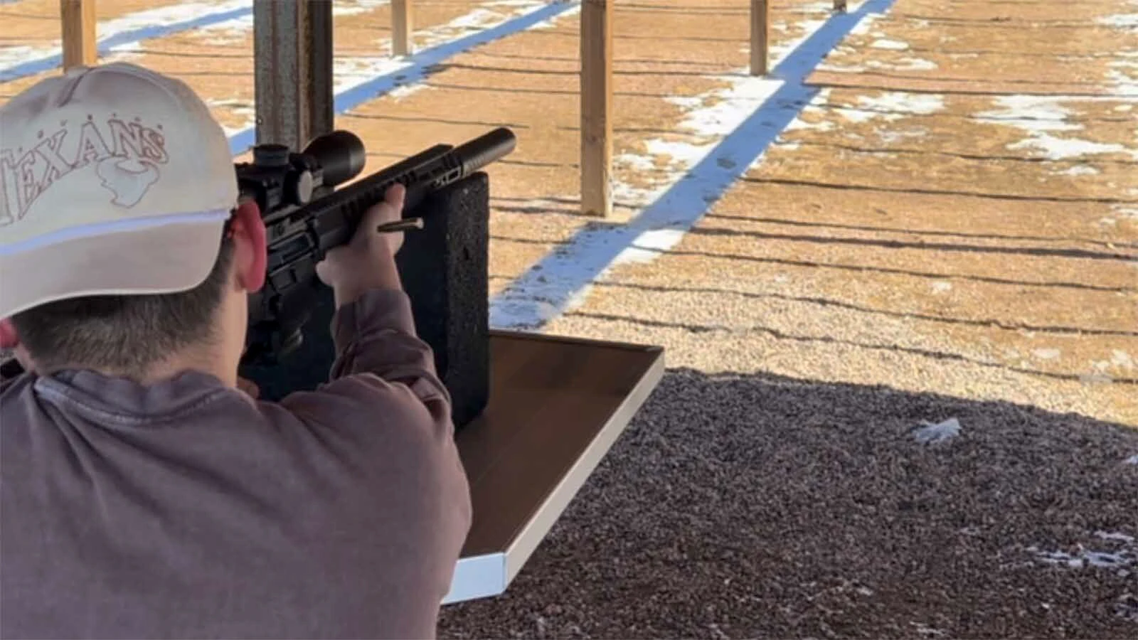A customer at Wyoming Tactical Firearms shoots an AR-15 rifle. The U.S. Supreme Court will consider overturing bans on such rifles in other states.