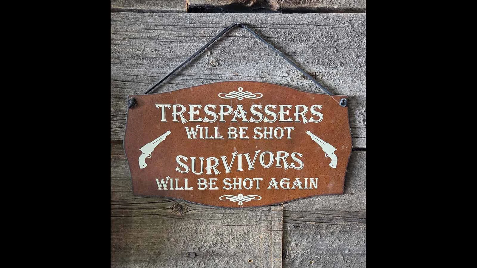 Signs suggesting that criminals will be shot if they try messing with the wrong house are popular in Wyoming’s gun culture.