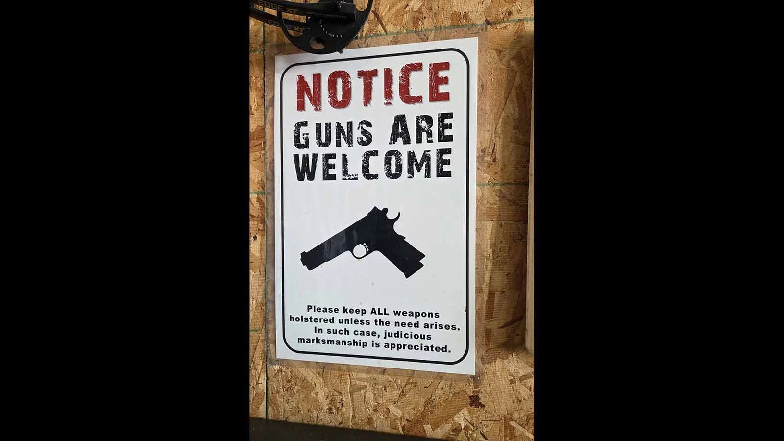 Signs suggesting that criminals will be shot if they try messing with the wrong house are popular in Wyoming’s gun culture.