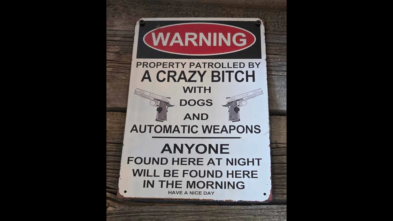 Signs suggesting that criminals will be shot if they try messing with the wrong house are popular in Wyoming’s gun culture.