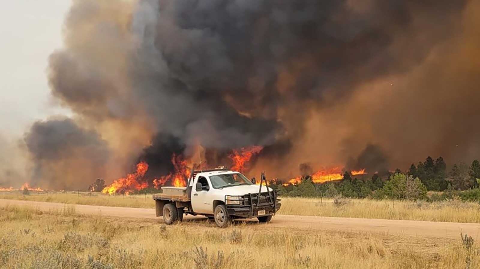 The Short Draw Fire burns right up to a road in Montana.