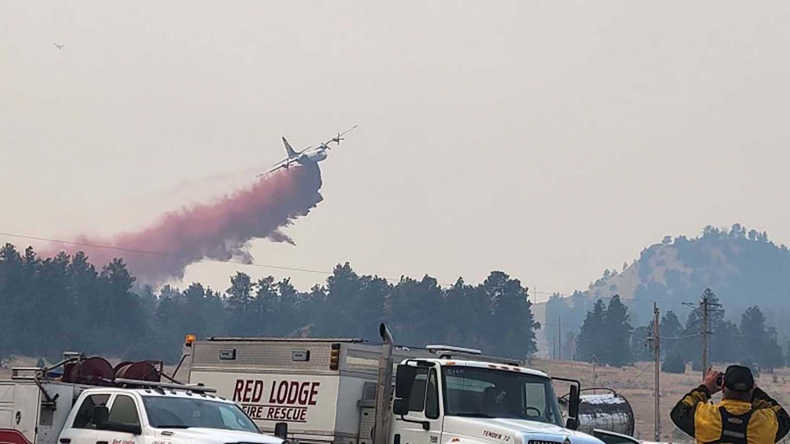 A plane drops fire retardant on the Short Draw Fire in Montana just north of the Wyoming border.