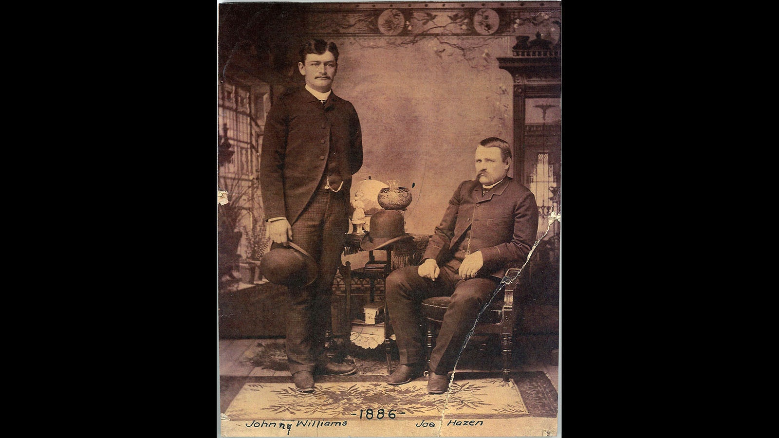 Josiah Hazen, standing right, with friend Johnny Williams in 1886.