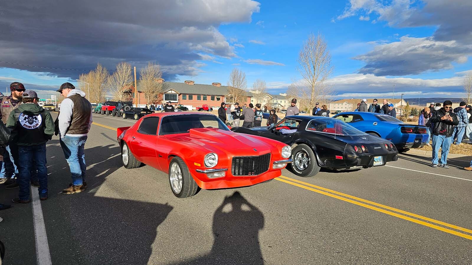 Muscle cars put on a show traveling along Pierce Street.