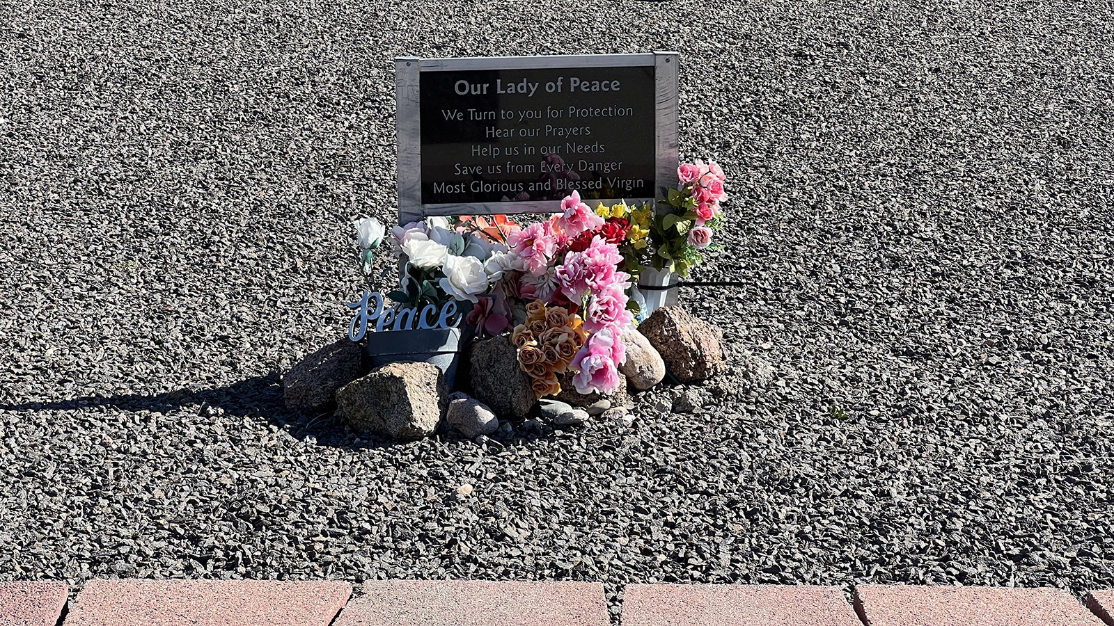 Fresh flowers are almost always left at the base of the Our Lady of Peace shrine in Pine Bluffs, Wyoming.