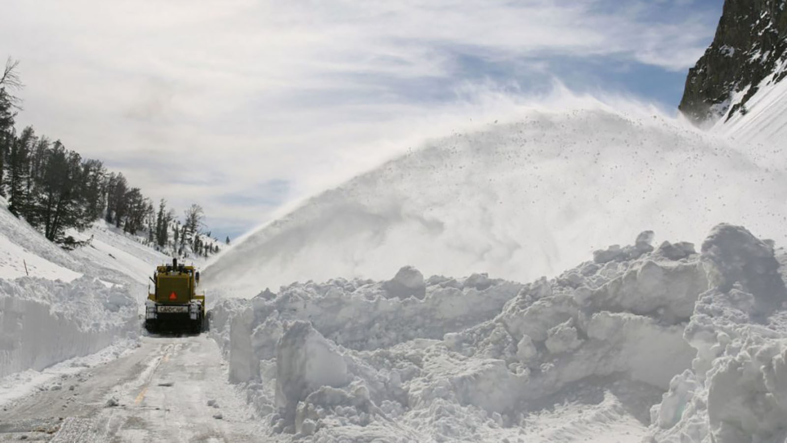 Plowing through the snowpack on National Park Service roads is one sign of spring in Wyoming.