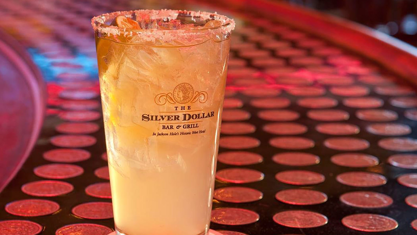 There's a lot to the Silver Dollar, but first and foremost it's a bar. And there's nothing like having your drink served up on the iconic silver dollar-infused bar.