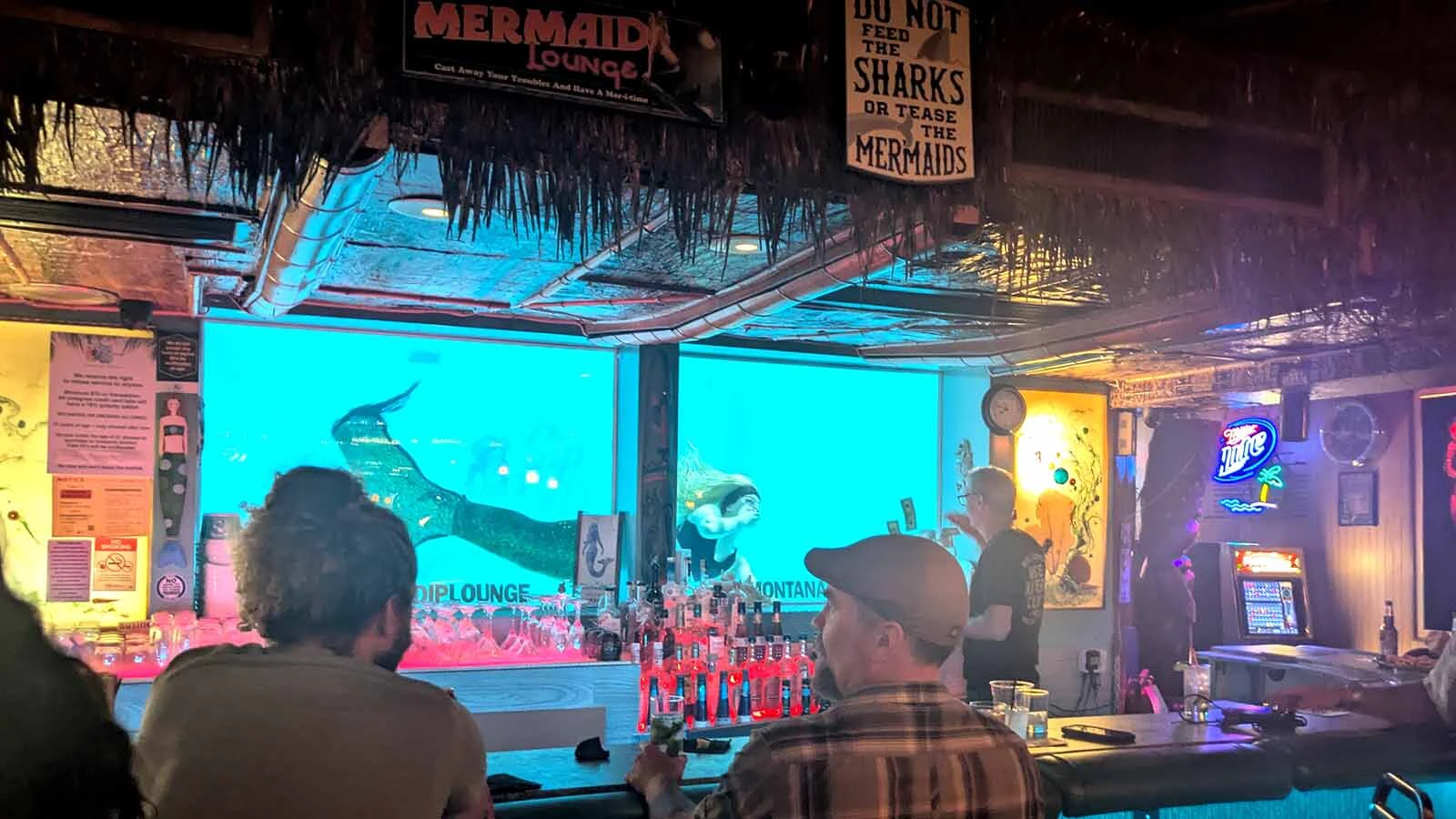 Grab a seat at the bar of the Sip 'N Dip for a front row view of the mermaids splashing around in the 8-foot pool.
