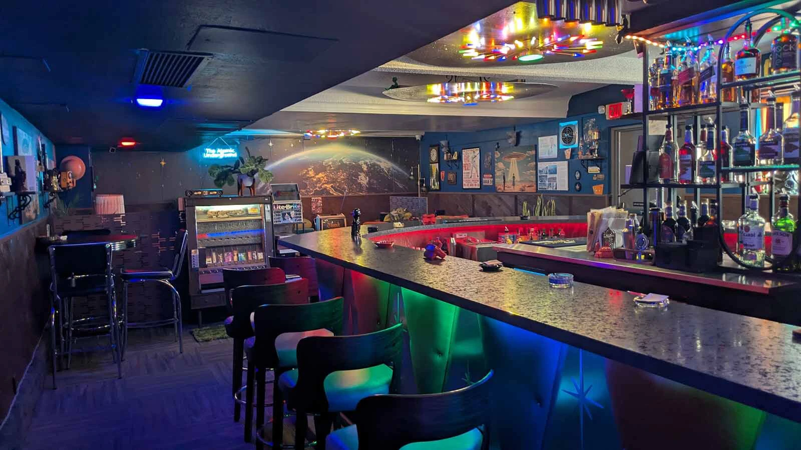 The vibe at the Atomic Underground Lounge is very different than its upstairs brethren. Think: A lot of aliens and relics of the 1970s.