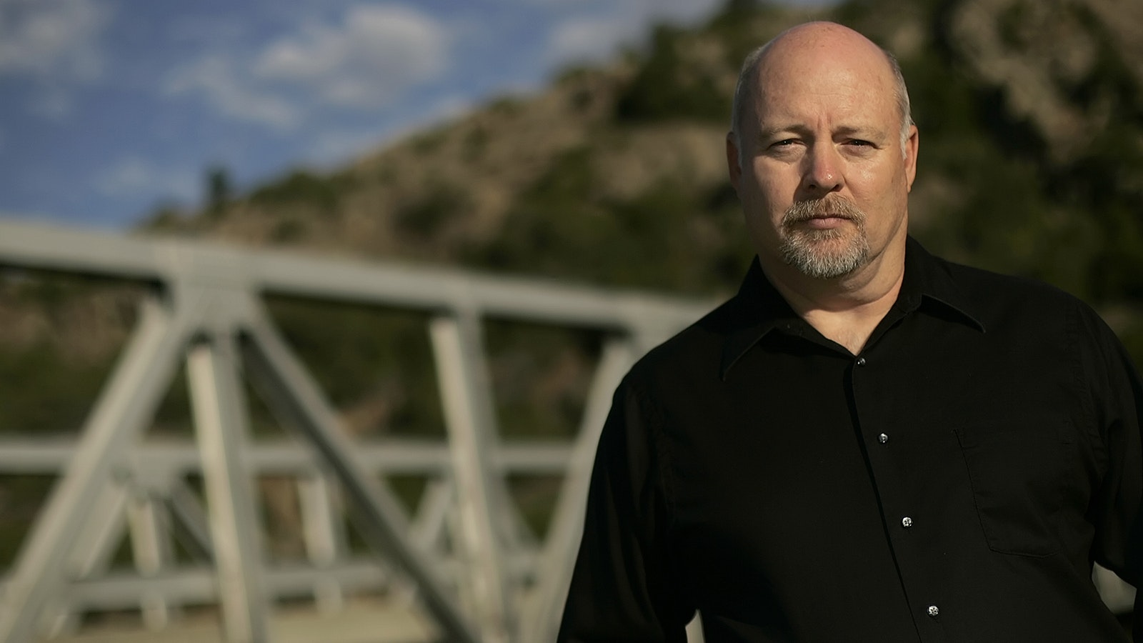 Neighbor to the 1973 victims and a best-selling author, Ron Frasncell stands at the Fremont Canyon Bridge where the 1973 tragedies occurred.