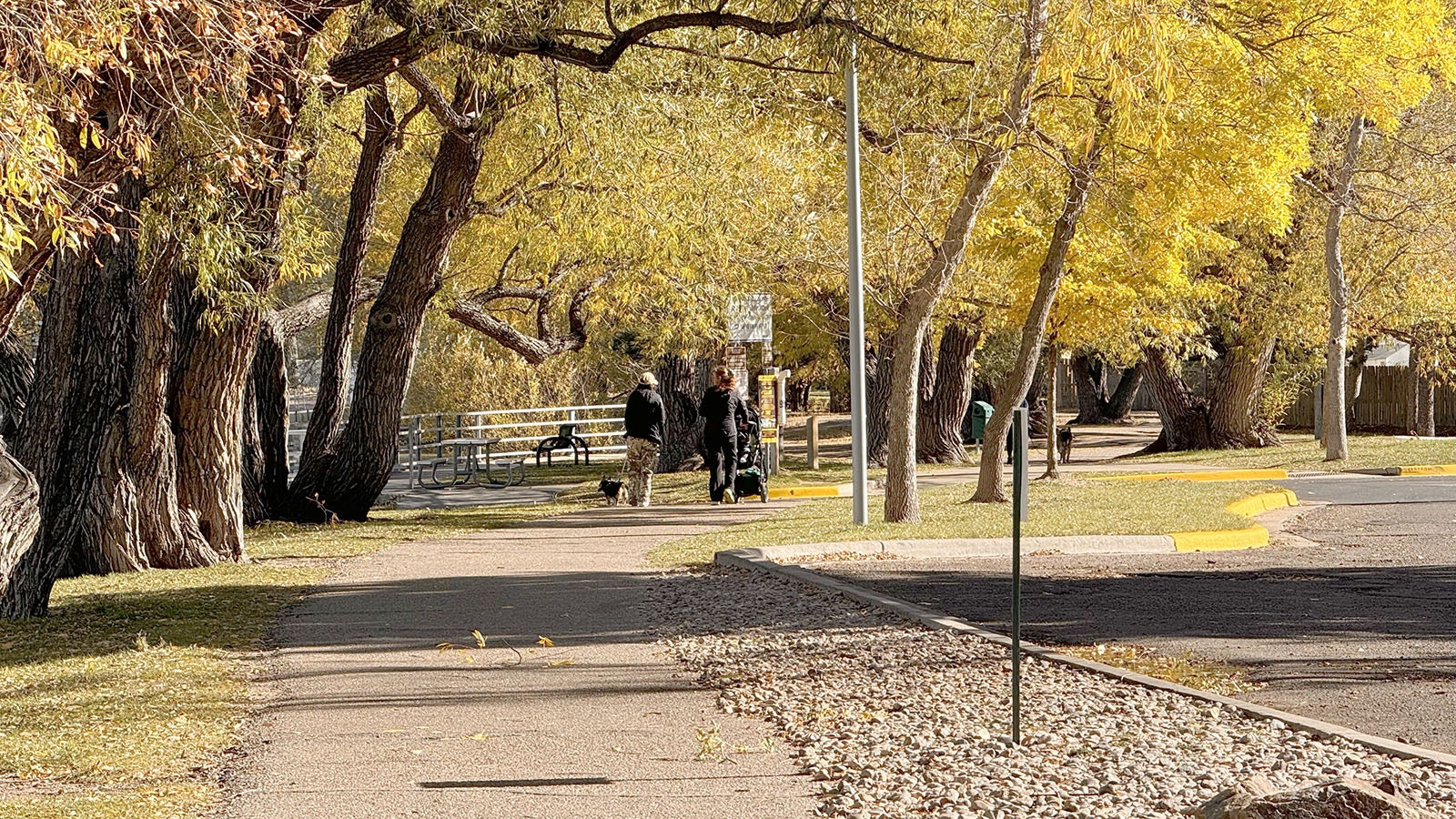 It's still much warmer than normal in Cheyenne, prompting walkers to take the path around Sloan Lake.