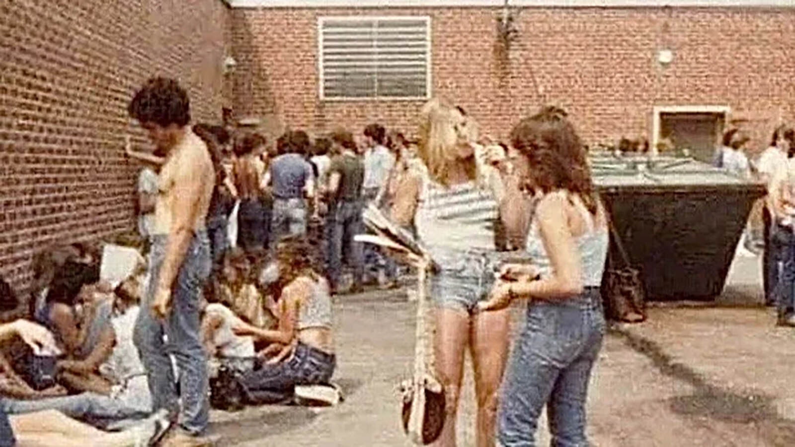 The designated smoking area behind a high school in the 1980s.