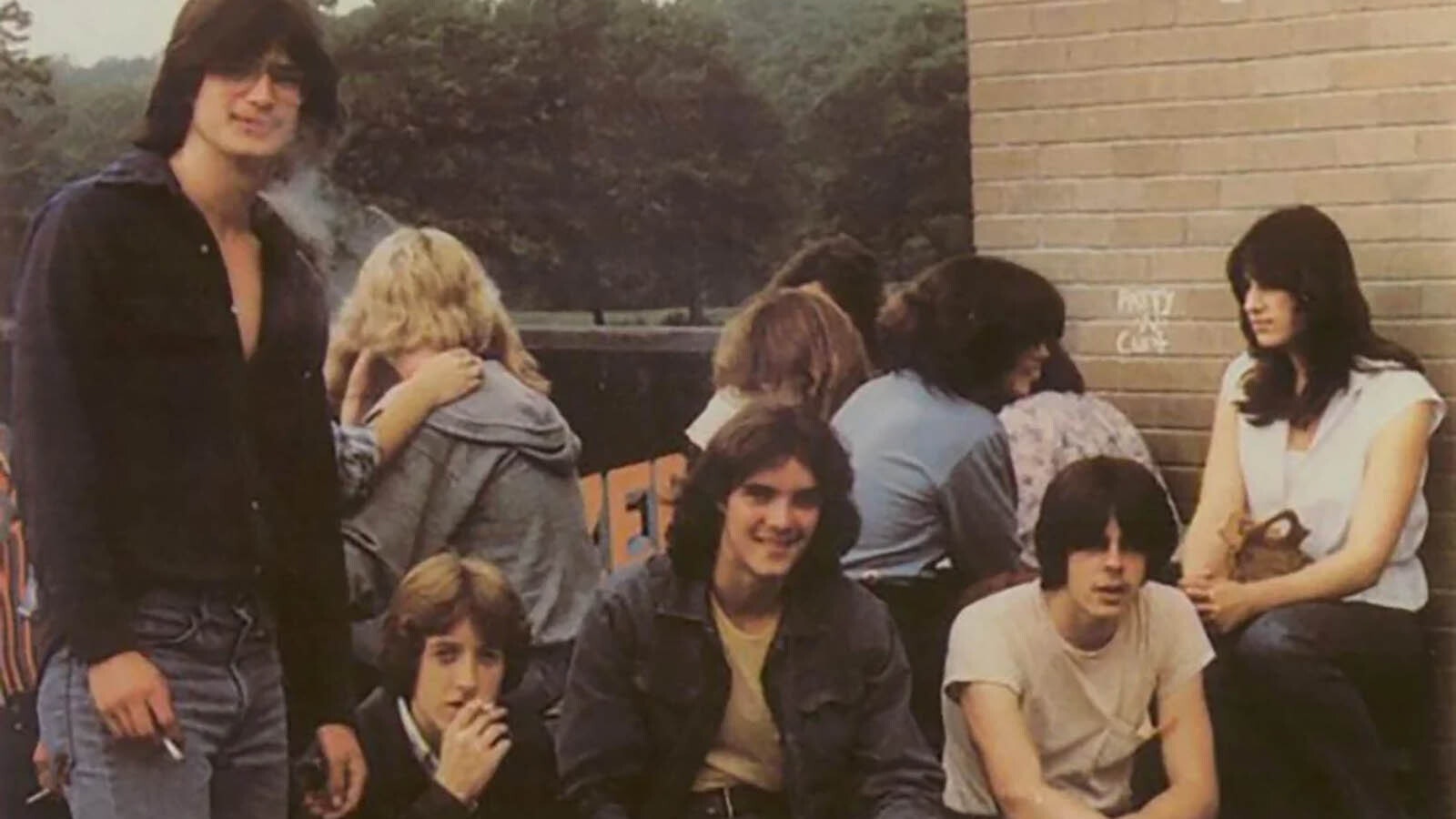 A group of high school students smoke at a designated smoking area at a New York high school in 1980 or 1981.