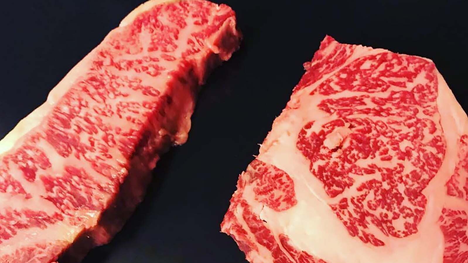 A Wagyu New York Strip, left, and ribeye served at the Snake River Grill.