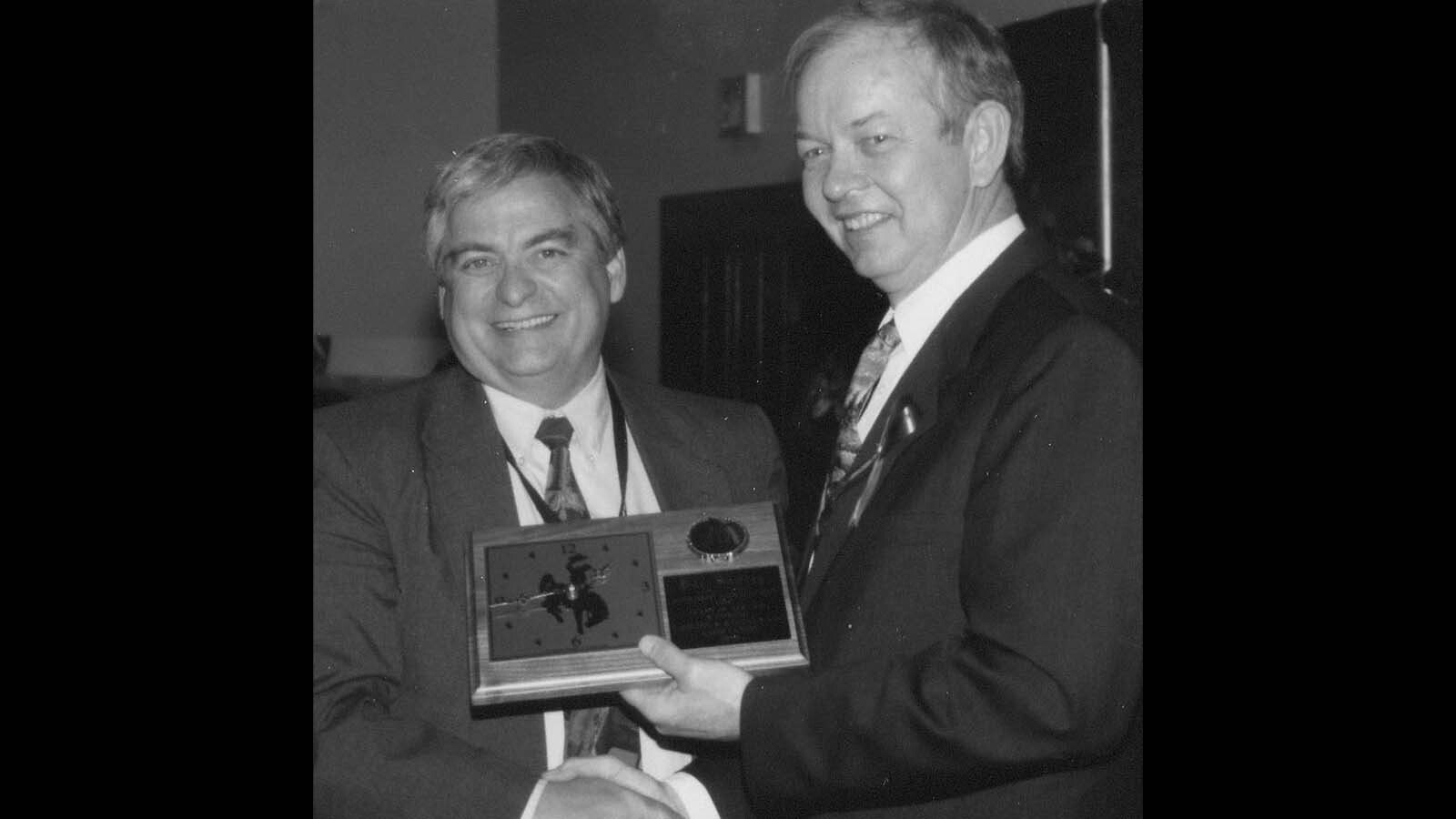 Bill Sniffin receiving the highest award from the Wyoming tourism industry, the Big WYO, from Gov. Jim Geringer in 2000.