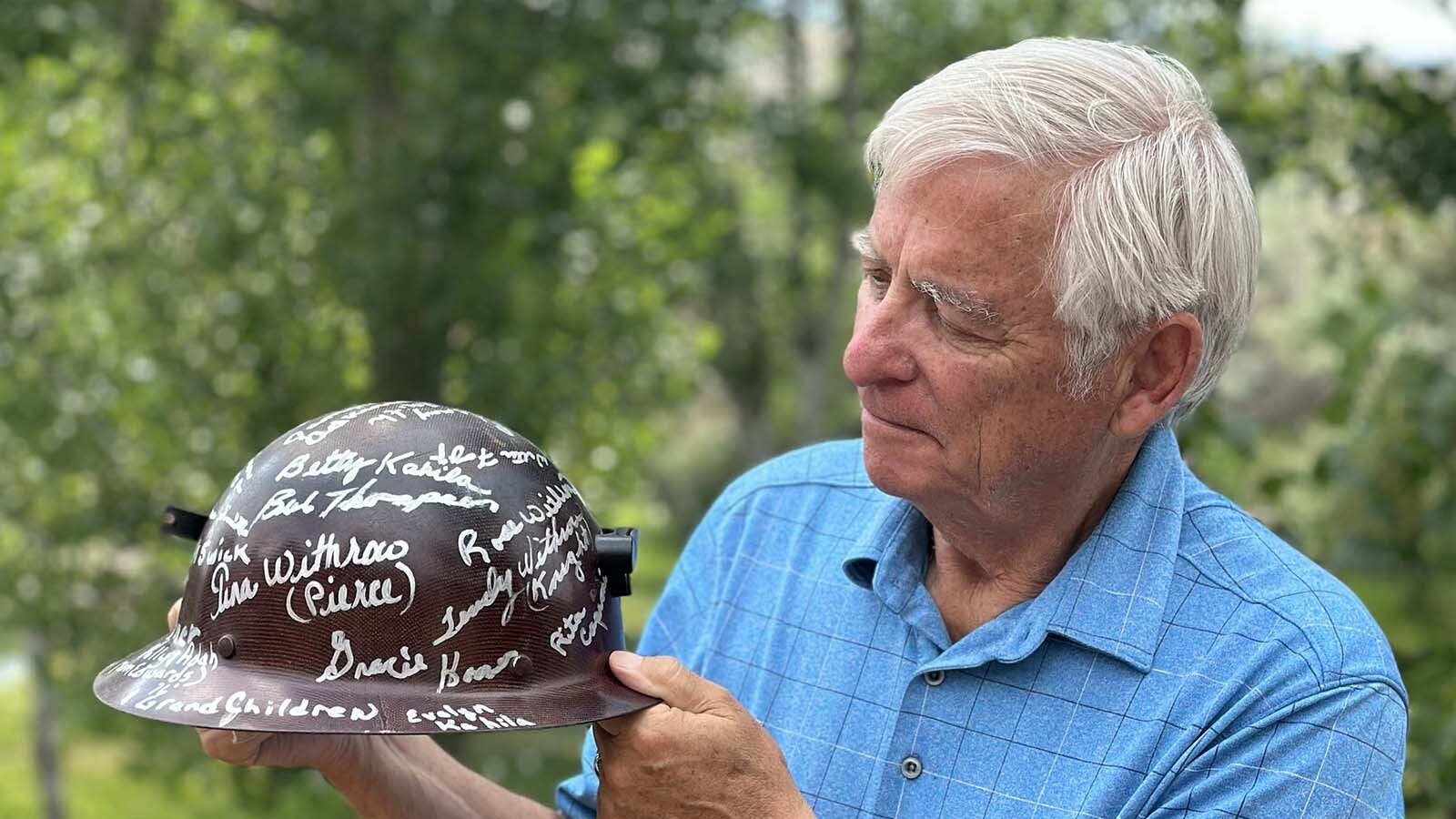 Veteran newspaperman Bill Sniffin with a signed miner's helmet, which he calls the greatest award he's ever received. It was a thank you from Lander-area miners after stories he published resulted in national legislation to help families of uranium miners.