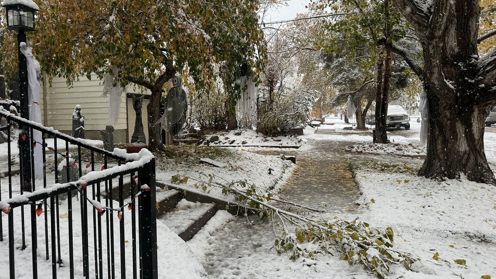 Snow falls across Wyoming, including on the Halloween decorations in yards along 10th Street in Casper.