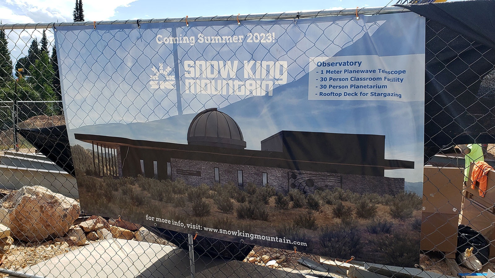 A poster shows what the observatory will look like when complete.