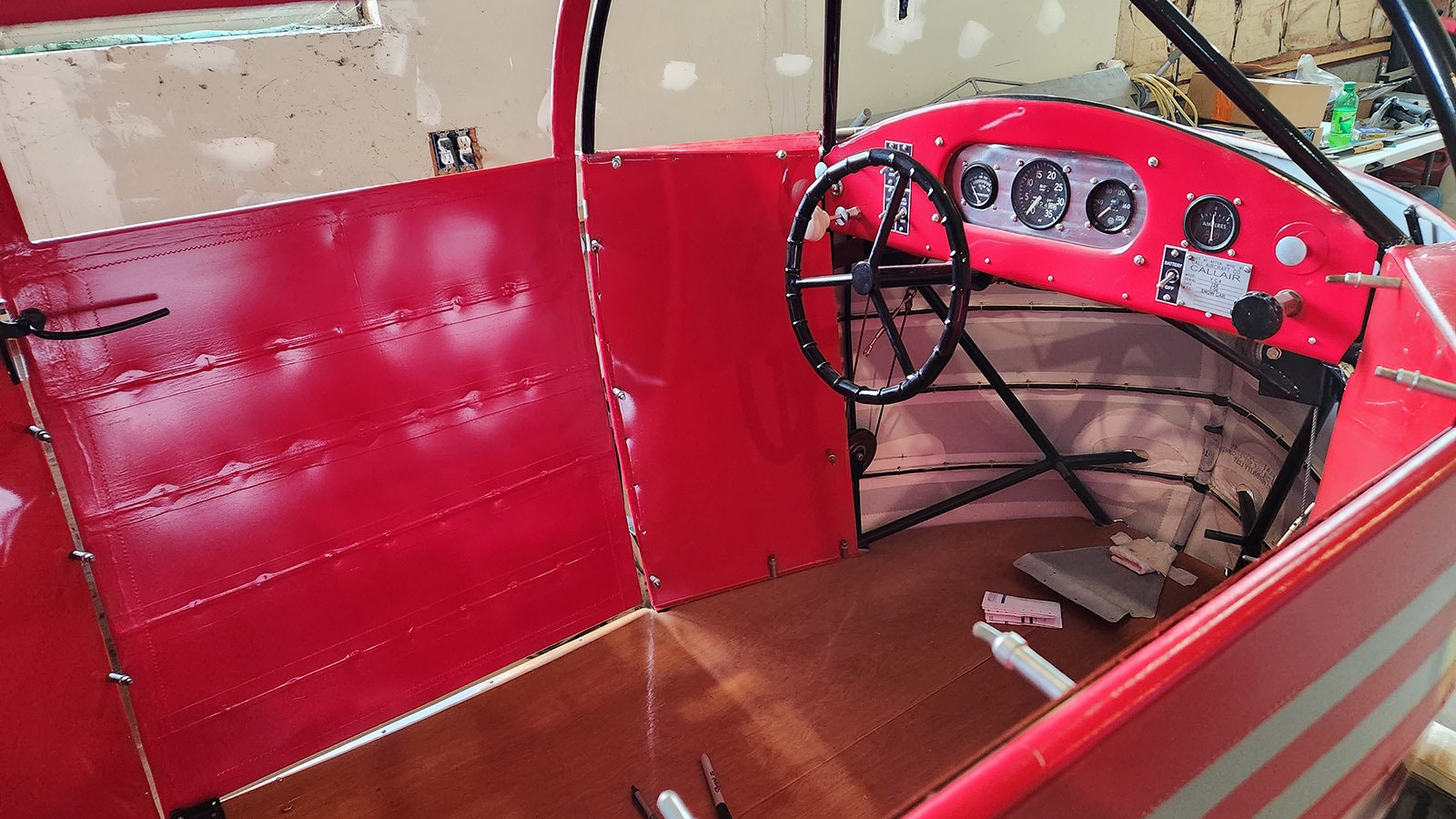 The interior of a CallAir snowplane. Since the Call Aircraft Company originally built airplanes, they used the same components to build their snowplanes, including the engine and propeller attached to the back.