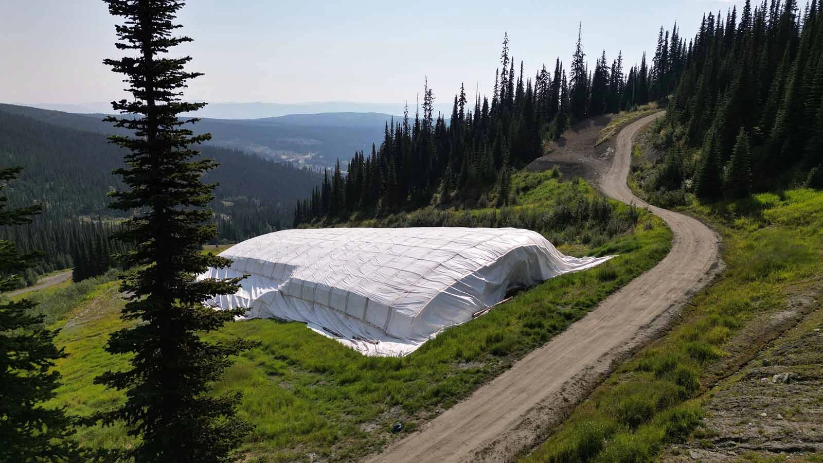 The Snow Secure mats can cover huge quantities of snow and keep them cool all summer long, as seen here at Sun Peaks Resort in Canada.