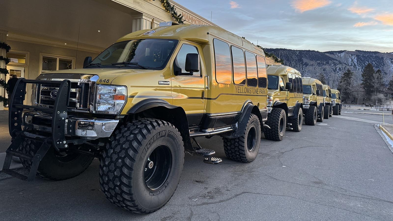 A fleet of Yellowstone snowcoaches awaiting passengers at Mammoth Hot Springs. The giant tires are inflated to 12 psi to ensure they can traverse the park's snow-covered roads.