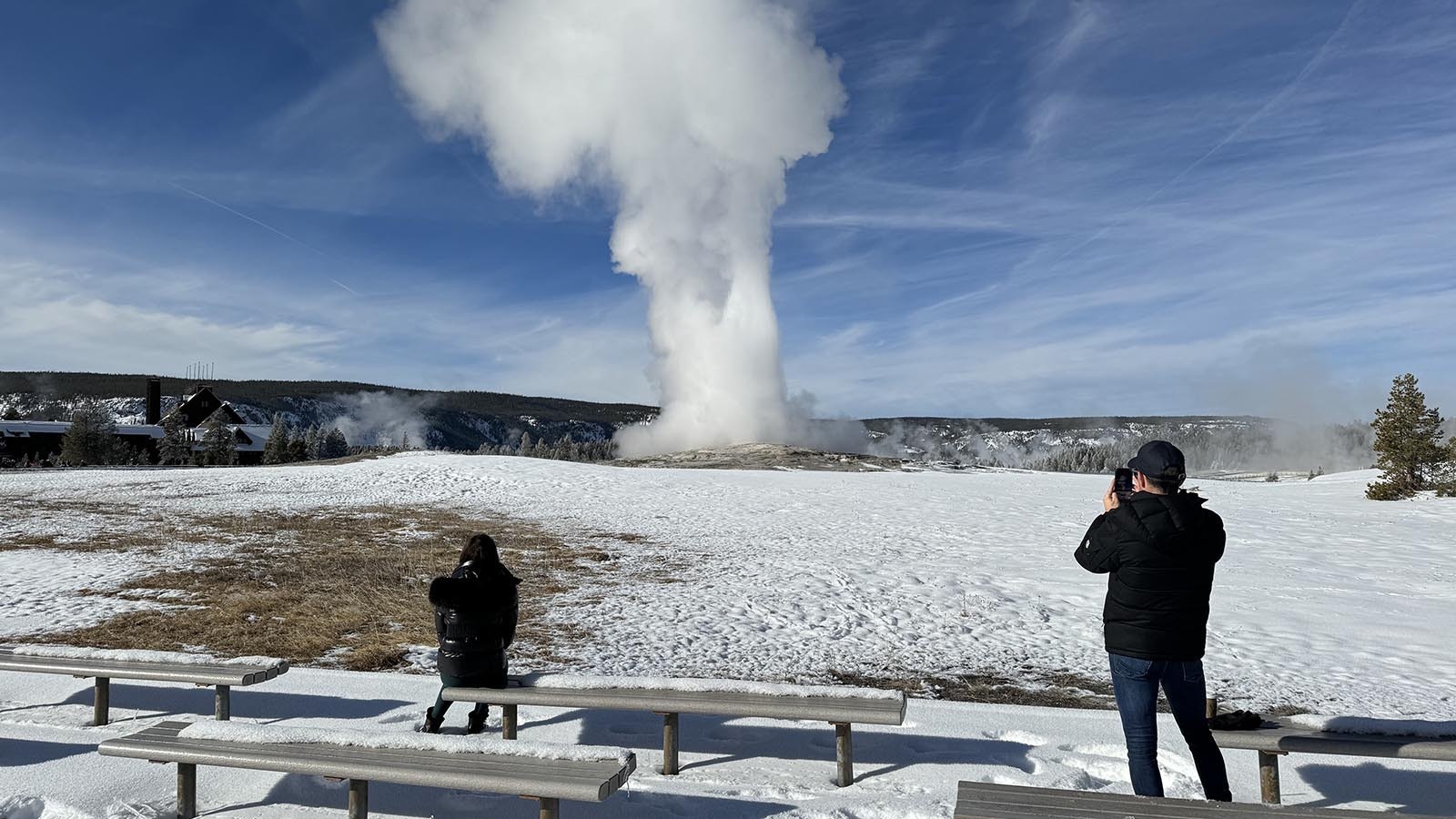 An Old Faithful eruption in mid-December. Thousands of people might be present during a single summer eruption, but only a few hundred will see a day's worth of eruptions in winter.