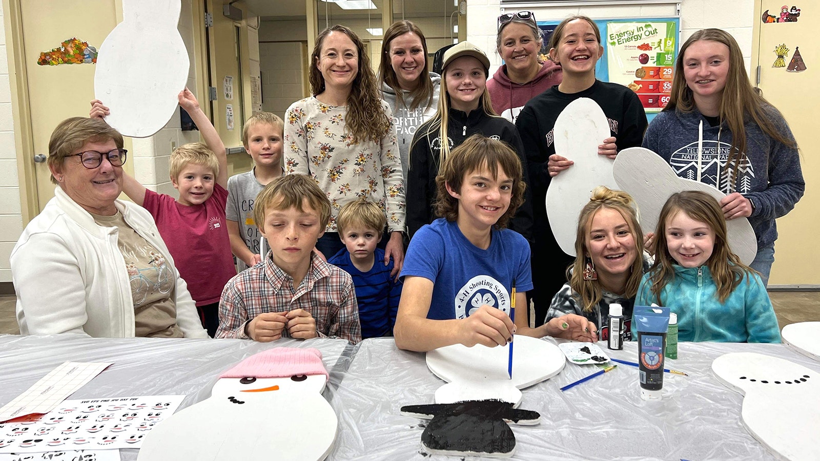 A group of 4-H participants decorate their snowmen for the Community Christmas Celebration.