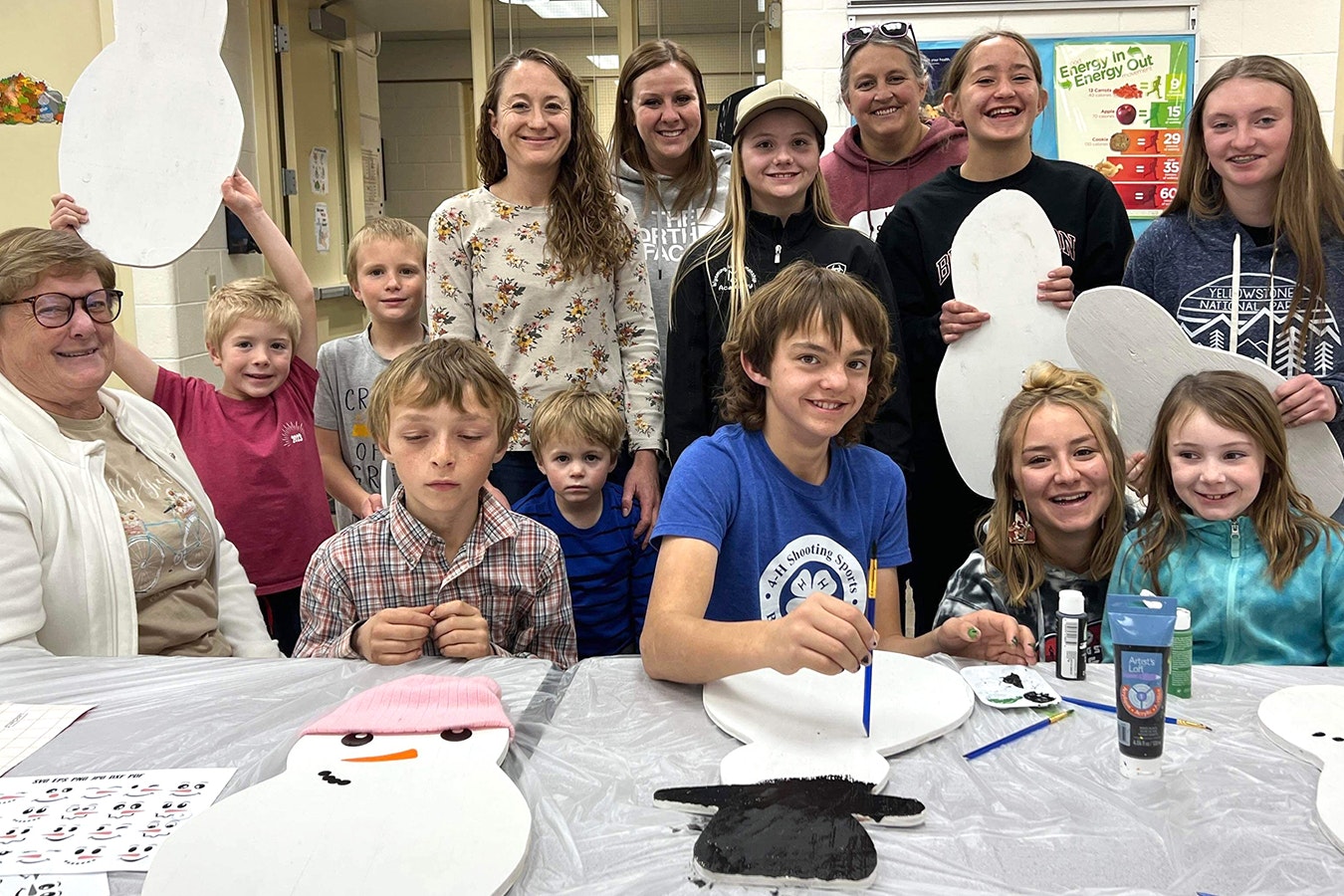 A group of 4-H participants decorate their snowmen for the Community Christmas Celebration.
