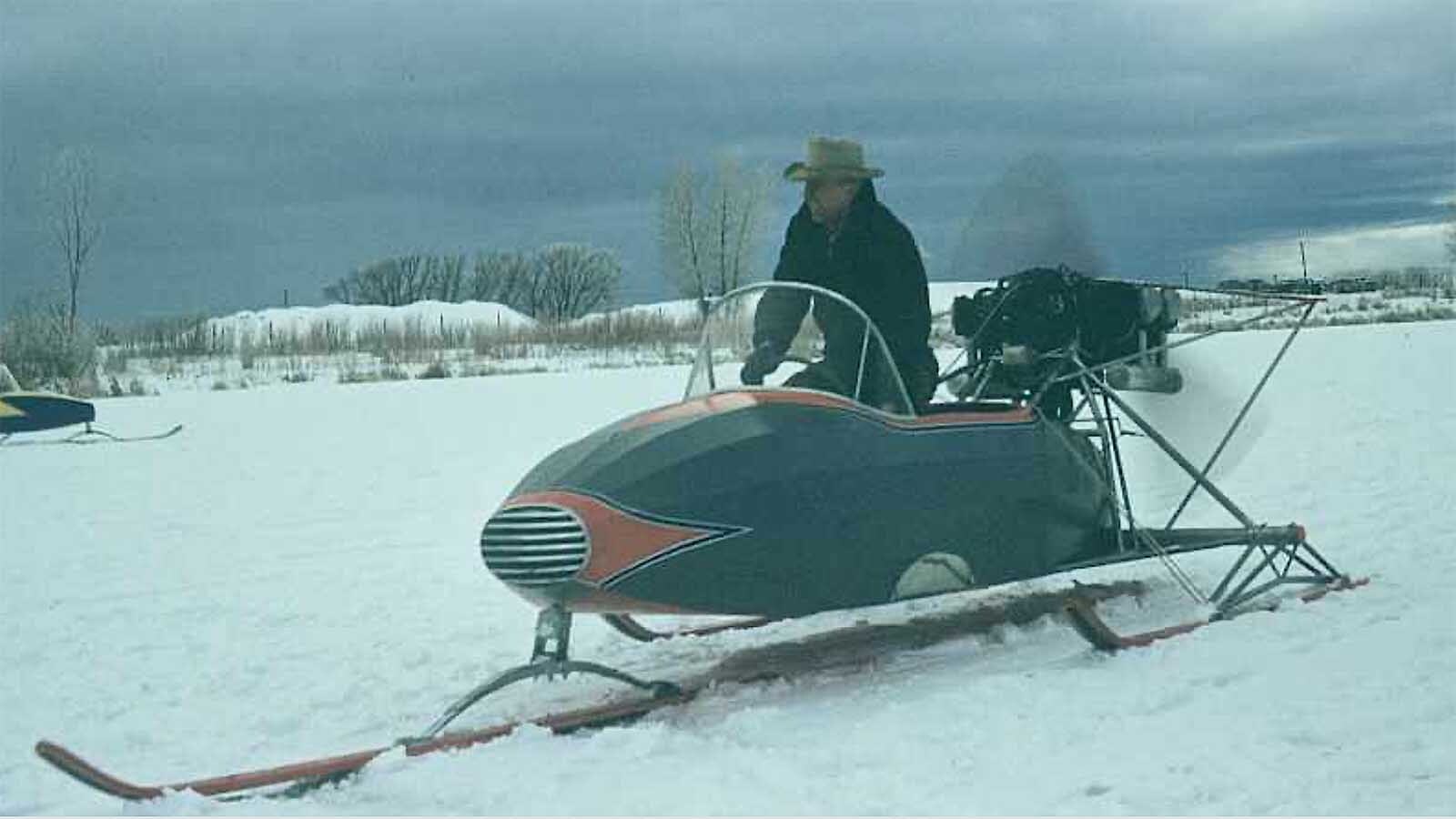 H.L. Wiese steers a snowplane at an event.