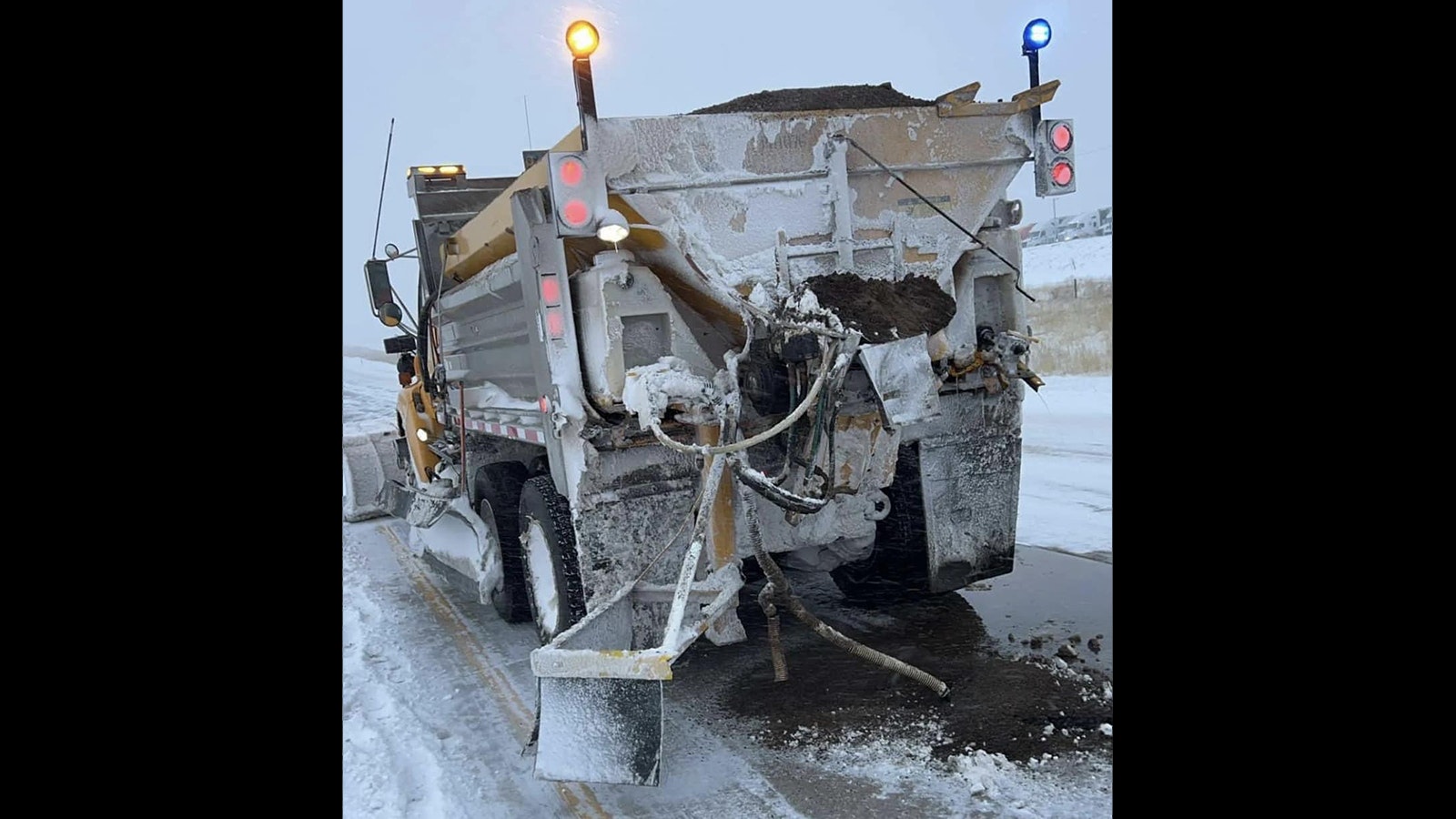 A snowplow that was hit from behind by a vehicle while clearing Interstate 80 near Baggs, Wyoming, during last weekend's storm.
