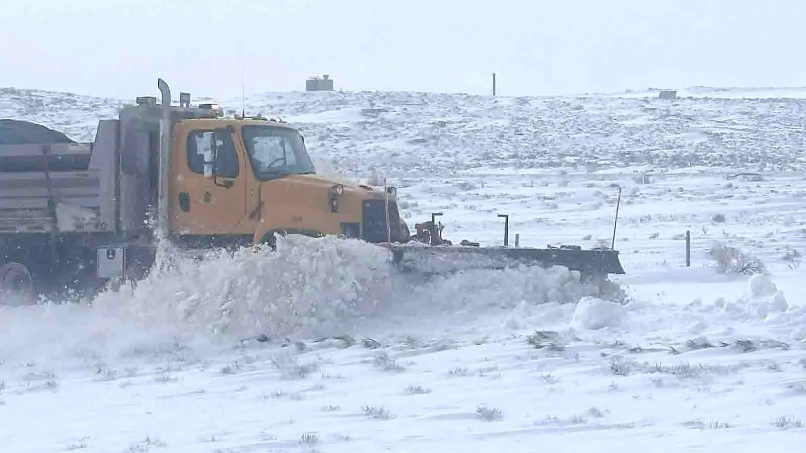 A WYDOT plow truck clears the westbound lane of I-80 between Rawlins and Wamsutter on Monday evening. Dozens of drivers were stuck on I-80 after both lanes between Rock Springs and Laramie were shut down for most of the day due to winter weather conditions, and at least one accident involving a WYDOT plow truck was reported. 